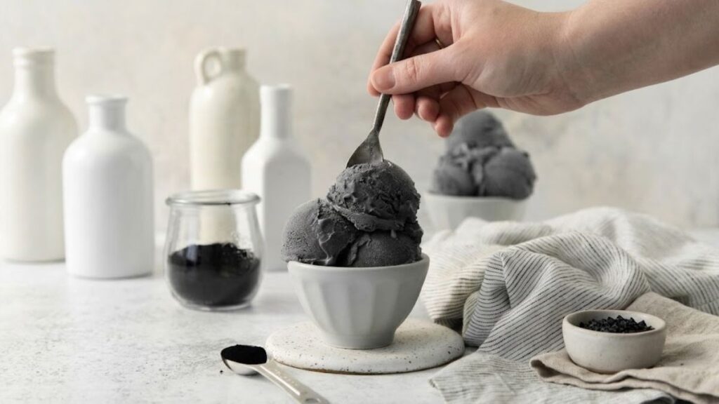 Black licorice ice cream served in a ceramic bowl