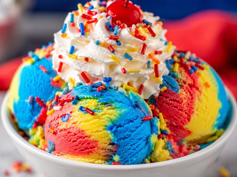 Creamy Superman ice cream served with colorful toppings