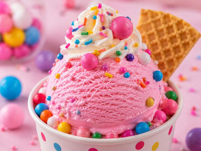 Bubble gum ice cream served with colorful toppings
