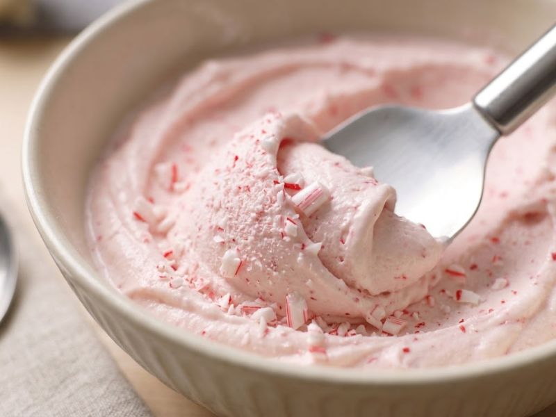 Adding crushed candy cane pieces to homemade ice cream