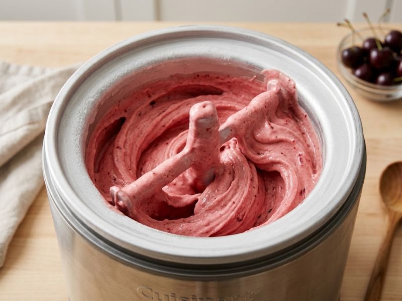 Cherry gelato churning in an ice cream maker