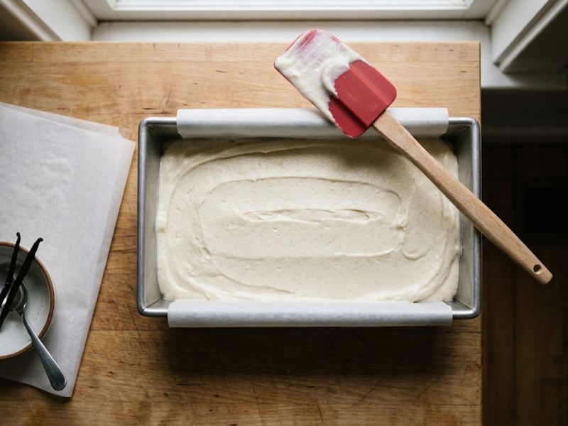 No-churn ice cream mixture smoothed into a loaf pan before freezing