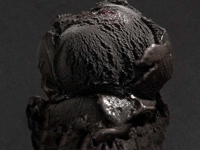 Close-up of the smooth texture of black licorice ice cream