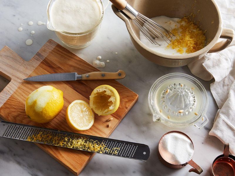 Ingredients for no churn lemon ice cream with cream condensed milk and fresh lemons